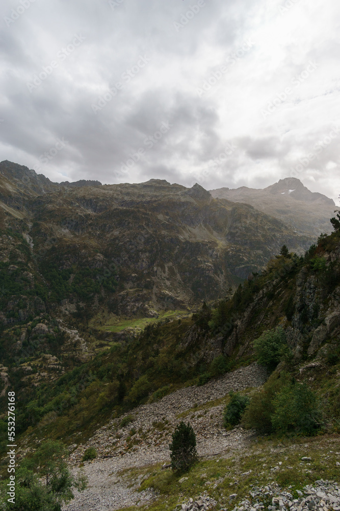 Fototapeta premium Beautiful pyrenees mountain landscape of Vallee du Soussoueou on a partly cloudy autumn day, Artouste, Nouvelle-Aquitaine, France