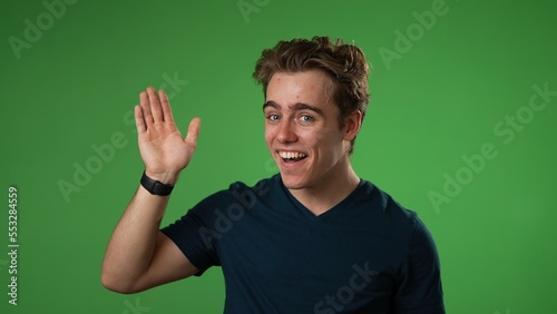 Canvas-taulu Portrait of happy young man 20s smiling scream and shout calling waving inviting