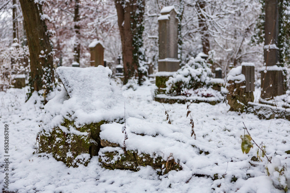 Fototapeta premium first snow on old grave yard haunted and decaying