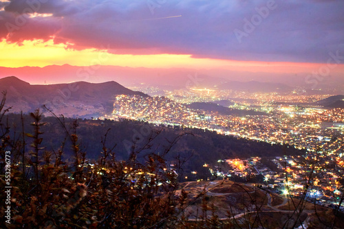 aereal view from a mountain, ligths of the overpopulation city in beautiful evening, sierra de guadalupe state of mexico and mexico city  photo