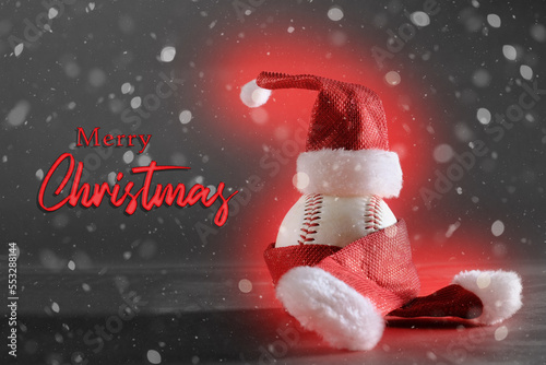 Wall Mural Baseball in Santa Claus hat with snow on black background by Merry Christmas text for holiday greeting of sport