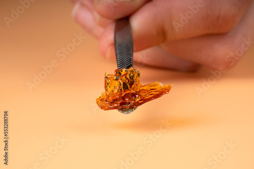 cannabis golden fresh live resin wax with high thc for stoner smoke. thc butane extract