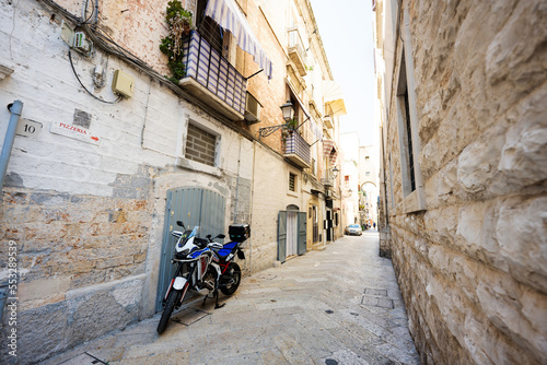 Motorcycle standing at the empty street of old italian town Bari  Puglia  South Italy.