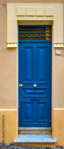A very narrow blue door