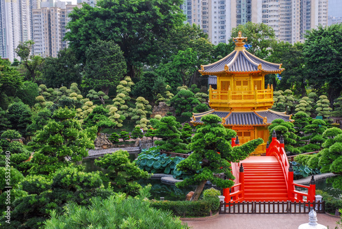 Nan Lian public garden in the city center  view of the Pavilion of Absolute Perfection also known as golden or octagonal pavilion. Residential skyscrapers in the background. Hong Kong  China.
