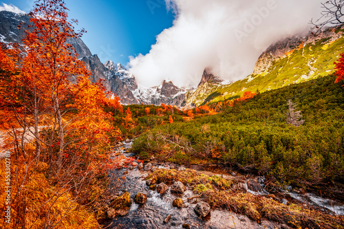 Hiking in national park High Tatras. HiIking from white lake to Green lake in the mountain landscape, Zelene pleso, Slovakia. photo