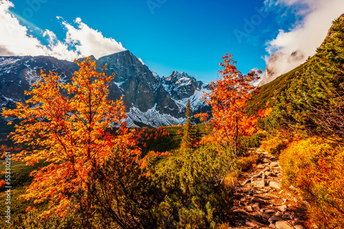 Hiking in national park High Tatras. HiIking from white lake to Green lake in the mountain landscape, Zelene pleso, Slovakia. photo