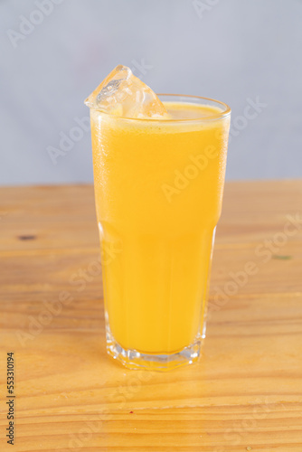 cocktail glass, on wood table