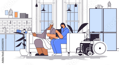 friendly nurse or volunteer supporting elderly woman home care services healthcare and social support concept