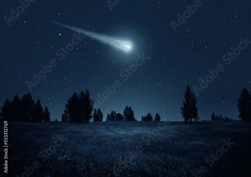 Fototapeta Night scene with a comet, asteroid, meteorite flying to Earth