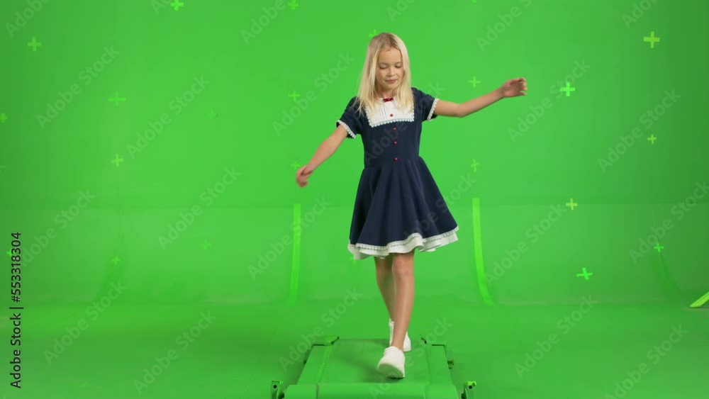 Young beautiful girl in dress walks on Green Screen, Chroma Key. Young beautiful girl in dress walks on Green Screen, Chroma Key.