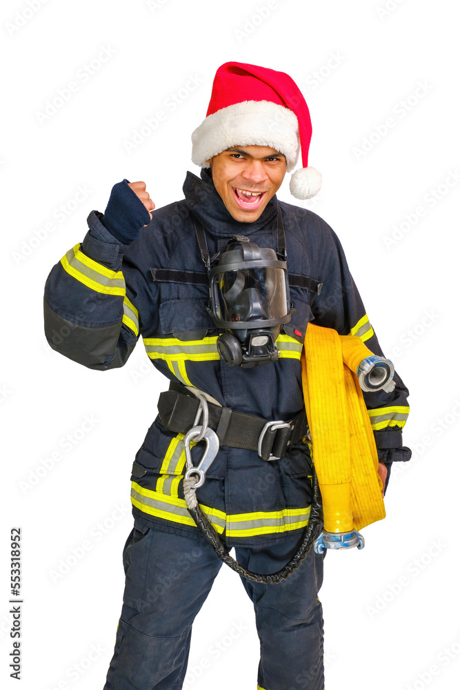 Exited young African American fireman in uniform and red Santa Hat holds fire hose in hand and looking at camera isolated on white background, vertical orientation Exited young African American fireman in uniform and red Santa Hat holds fire hose in hand and looking at camera isolated on white background, vertical orientation