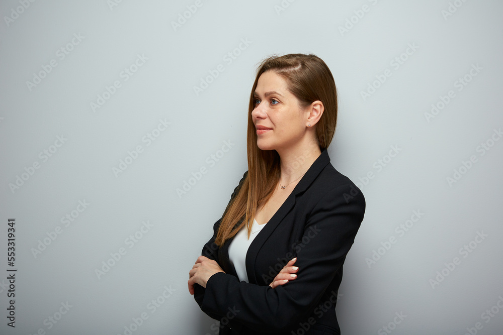 Smiling business woman in black suit looking away, isolated profile portrait. Smiling business woman in black suit looking away, isolated profile portrait.