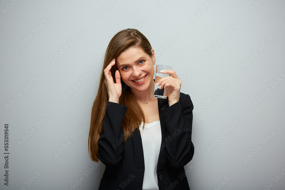 Smiling young woman holding glass with water. isolated female portrait. Smiling young woman holding glass with water. isolated female portrait.