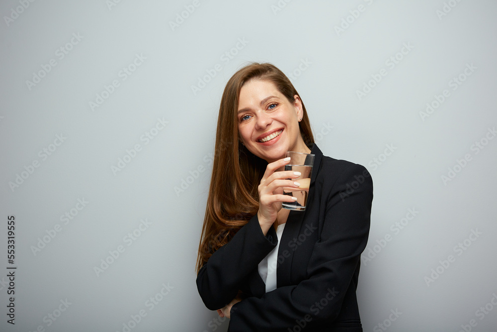 Smiling young woman holding glass with water. isolated female portrait. Smiling young woman holding glass with water. isolated female portrait.