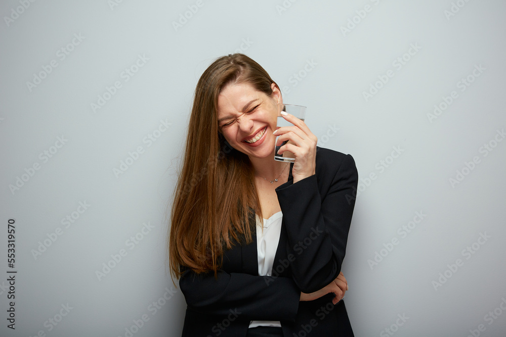 Happy business woman holding water glass. isolated female portrait with black suit. Happy business woman holding water glass. isolated female portrait with black suit.