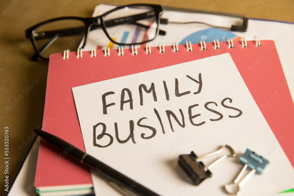 Family business inscription on paper and graph Family business inscription on paper and graph