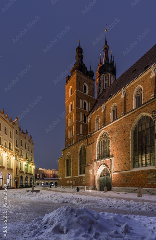 St Mary's church viewed from covered Mariacki Square in winter Krakow