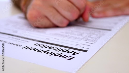 opportunities, job - man's hand filling out employement application