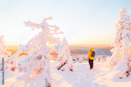 Young woman in winter forest in Finland