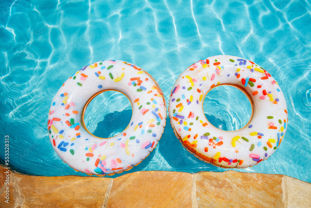 Inflatable donuts in swimming pool