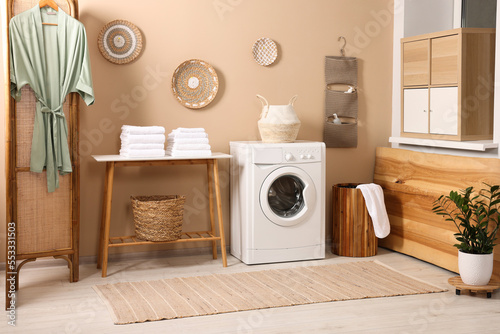 Stylish laundry room with modern washing machine. Interior design © New Africa