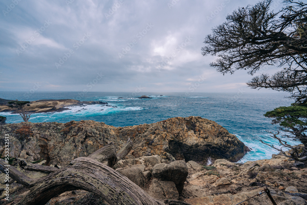 Rocky beach and ocean view on a moody overcast day, Monterey Bay, California