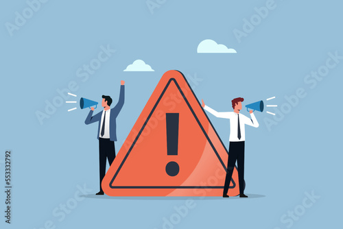 Attention or warning information, breaking news or urgent message communication with businessmen holding megaphone, important announcement photo