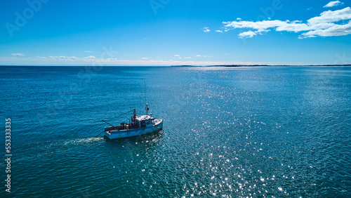 Fishing boat for lobster and clams on Maine ocean © Nicholas J. Klein