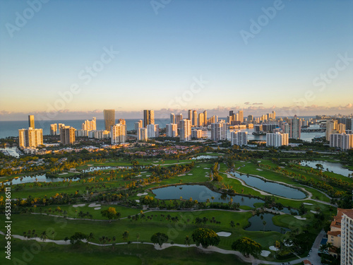 city skyline at sunset with golf course foreground