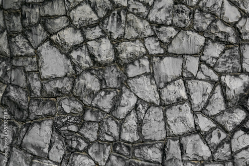 Texture of grey stone wall as background