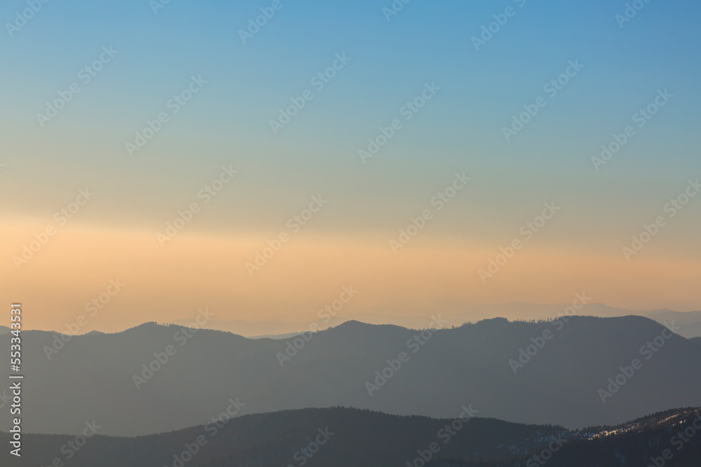 Line of mountains and evening sky