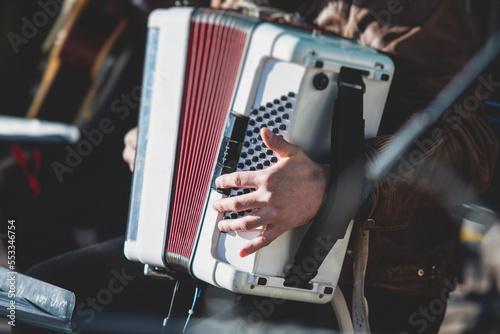 Sticker Concert view of accordion player performing on a stage with vocalist and jazz gr