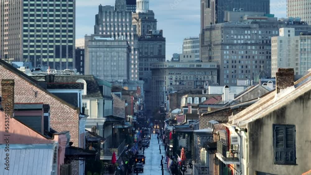 Bourbon Street in New Orleans French Quarter. Rising aerial reveal of architecture during golden hour light.