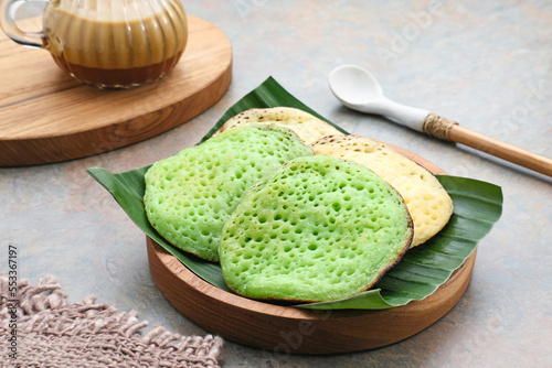 Serabi or Surabi,  Indonesian pancake made of flour, rice flour and coconut milk. Served with palm sugar sauce. Sweet and savory. 
 photo