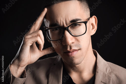 Young Asian man in eyeglass...