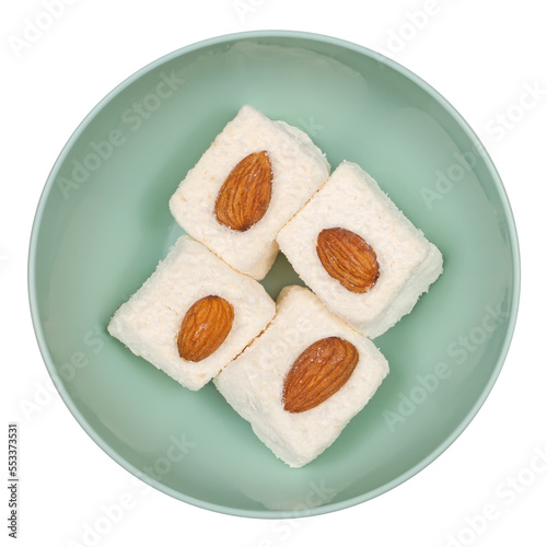 Lucum with mendal in a plate on a white background. photo