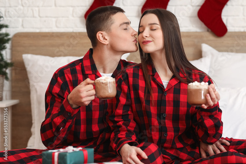 Young couple in matching re...