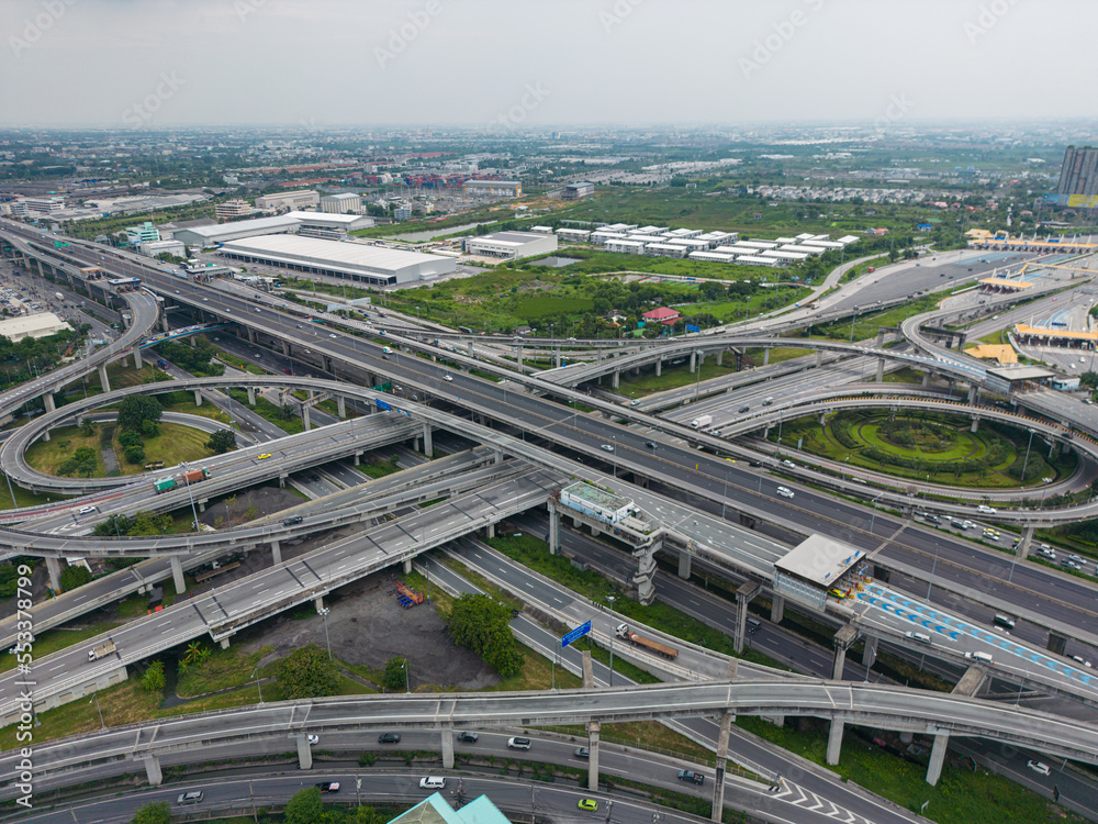 Fototapeta premium Aerial view city junction road with vehicle movement