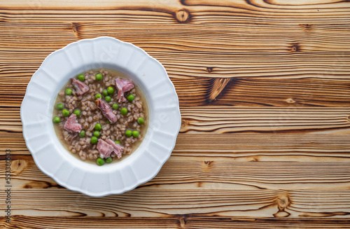 smoked meat with groats and green peas