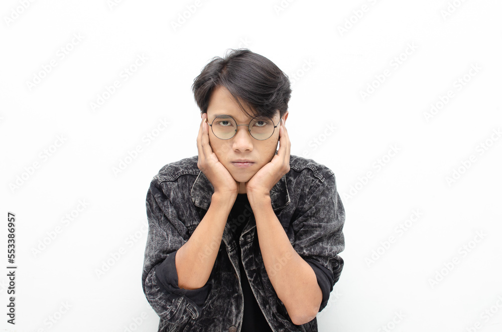 Thoughtful asian man thinking and wondering with hand touching skin as thinking gesture isolated over white background Thoughtful asian man thinking and wondering with hand touching skin as thinking gesture isolated over white background