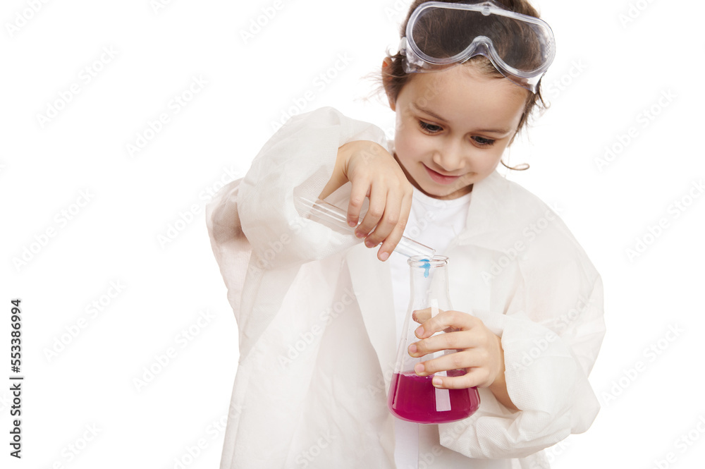 Smart little girl in lab coat, pouring a chemical reagent from test tube into flat-bottomed flask with purple liquid substance while doing experiments in chemistry class, isolated on white background Smart little girl in lab coat, pouring a chemical reagent from test tube into flat-bottomed flask with purple liquid substance while doing experiments in chemistry class, isolated on white background