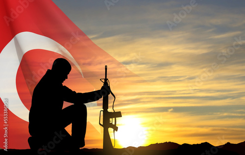 Silhouette of soldier kneeling down on the sunset and Turkey flag. Greeting card for Turkish Armed Forces Day, Victory Day, National Holidays. EPS10 vector