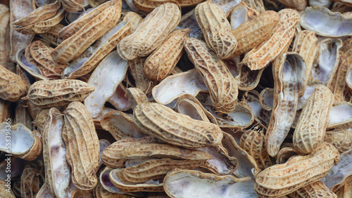 full of peanut shells seedless.
brown nut shells background