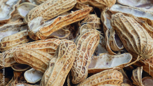 full of peanut shells seedless.
brown nut shells background