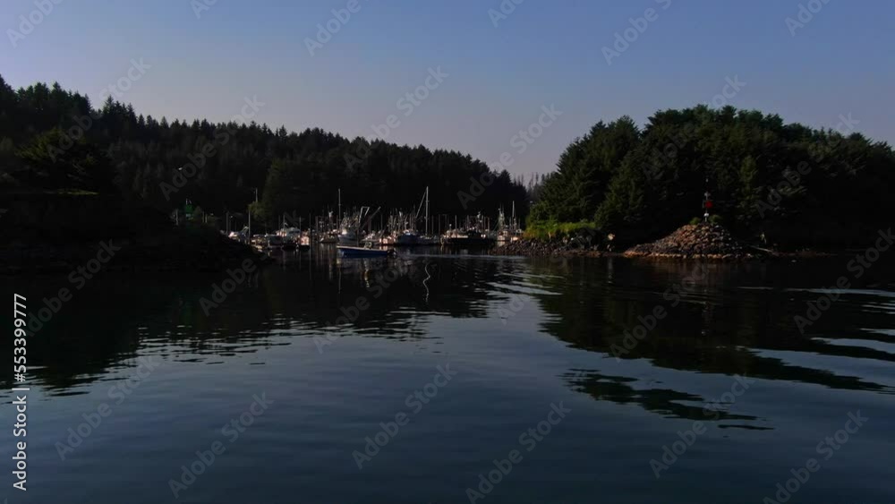 Aerial View Over Calm Sea Water Towards Fishing Marina Port and Boats in Juneau Region Alaska in Early Summer Morning Aerial View Over Calm Sea Water Towards Fishing Marina Port and Boats in Juneau Region Alaska in Early Summer Morning