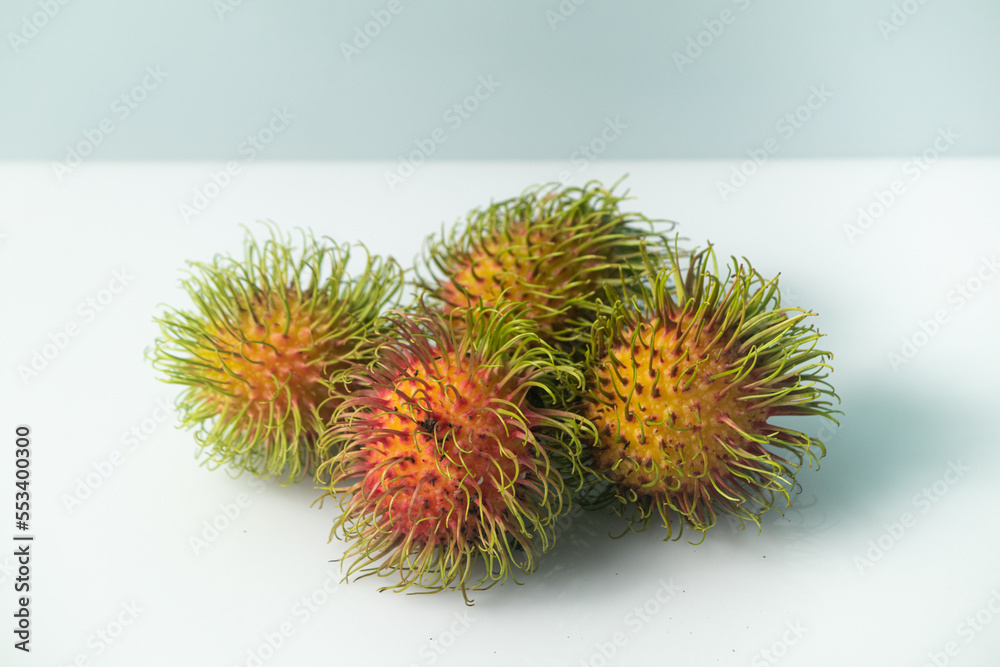 Tropical fruit rambutan on a white background