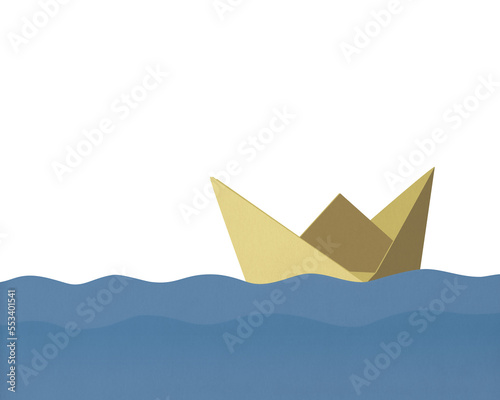 Folded paper boat floating on water