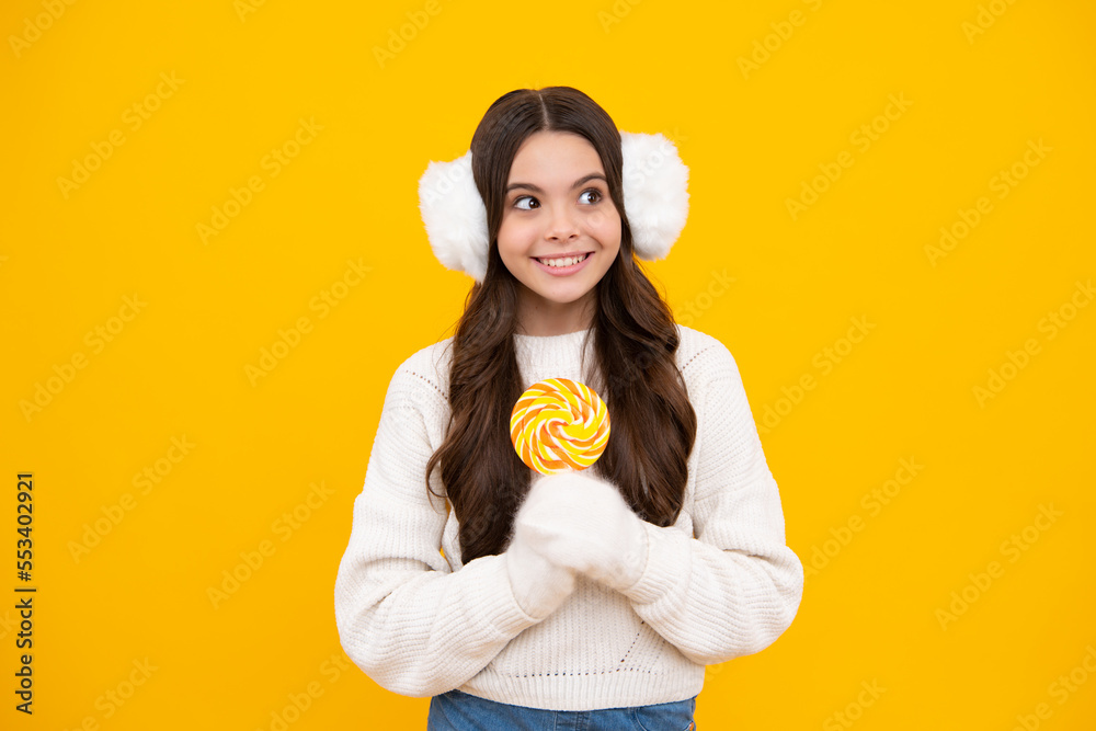 Hipster teenager child girl lick lollypop. Sugar nutrition, candy and sweets. Child eat lollipop popsicle. Happy face, positive and smiling emotions of teenager girl. Hipster teenager child girl lick lollypop. Sugar nutrition, candy and sweets. Child eat lollipop popsicle. Happy face, positive and smiling emotions of teenager girl.