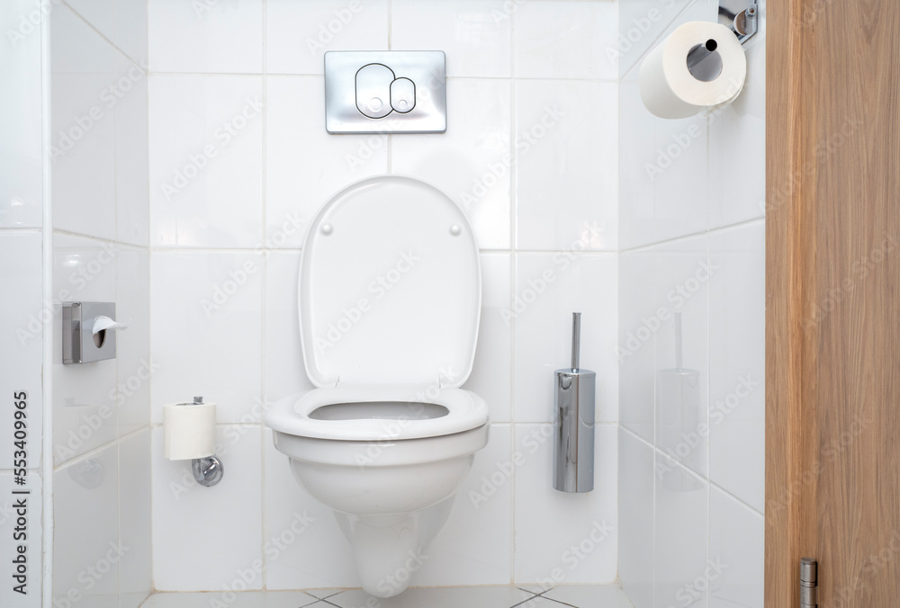 Interior of toilet with white ceramic toilet bowl. Modern minimal style of bathroom in hotel. Interior of toilet with white ceramic toilet bowl. Modern minimal style of bathroom in hotel.